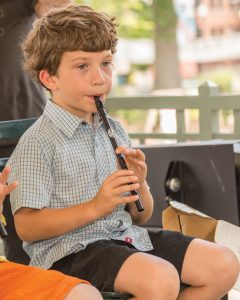 Louis playing the pennywhistle, a student at the Riley School of Irish Music