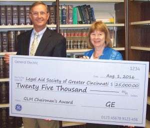 GE’s Bradley Mottier with Legal Aid executive director Mary Asbury