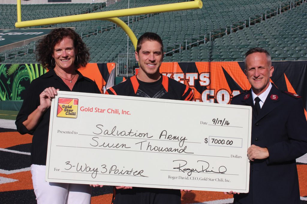 Mickey Kamfjord of Gold Star Chili; Mike Nugent, Bengals place kicker; and Major Larry Ashcraft, divisional leader, Salvation Army Southwest Ohio/Northeast Kentucky