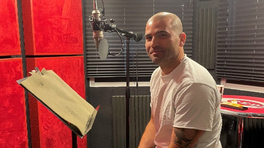 Joey Votto poses for a picture while recording his lines for upcoming performances of "The SpongeBob Musical" by The Children's Theatre of Cincinnati.