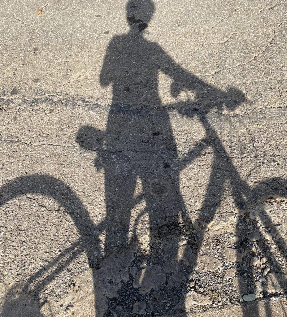 Self-portrait with bike. Elizabeth Mariner
